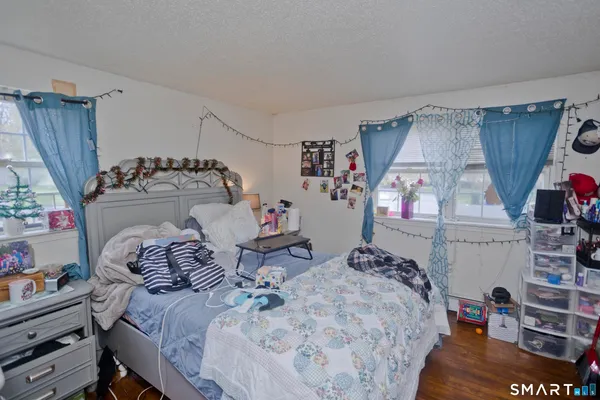 a bedroom with bed and a window