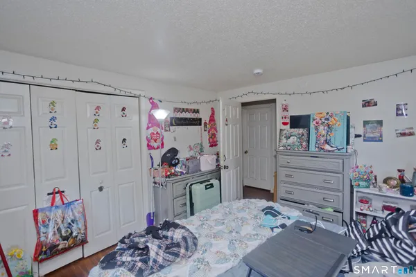 a bedroom with a bed and cabinets