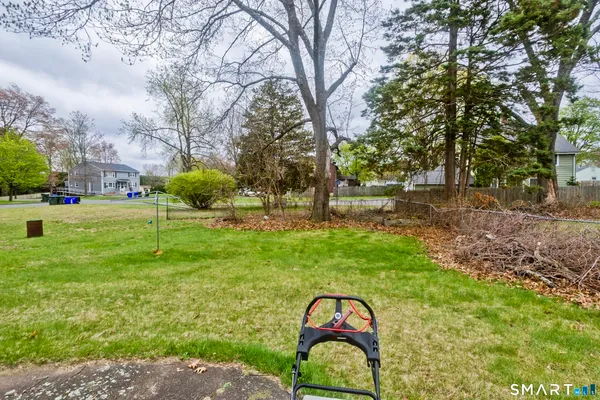 a backyard of a house with lots of green space