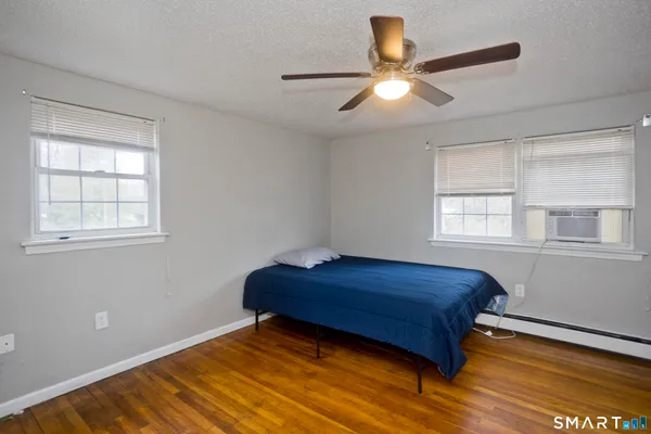 a room with a bed and a window
