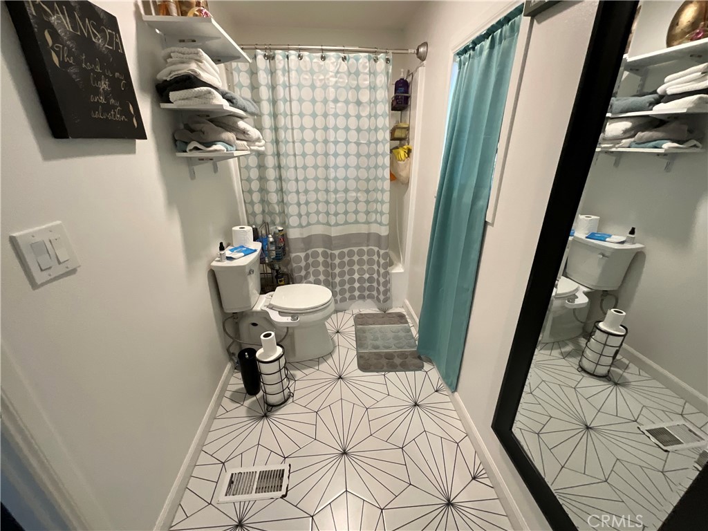 15621 Beach Boulevard, Unit 28 Huntington Beach, CA 92647 - Photo 12 of 27 a bathroom with a sink and toilet