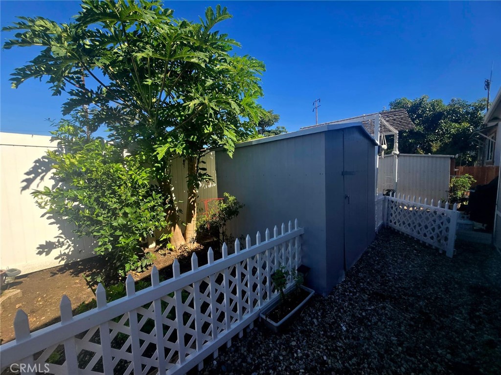 15621 Beach Boulevard, Unit 28 Huntington Beach, CA 92647 - Photo 20 of 27 a couple of flower plants in front of gate