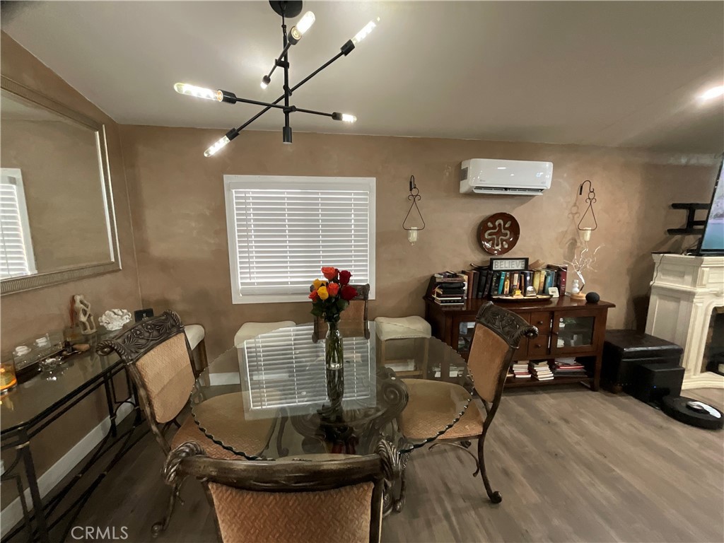 15621 Beach Boulevard, Unit 28 Huntington Beach, CA 92647 - Photo 3 of 27 a living room with furniture a window and gym equipment
