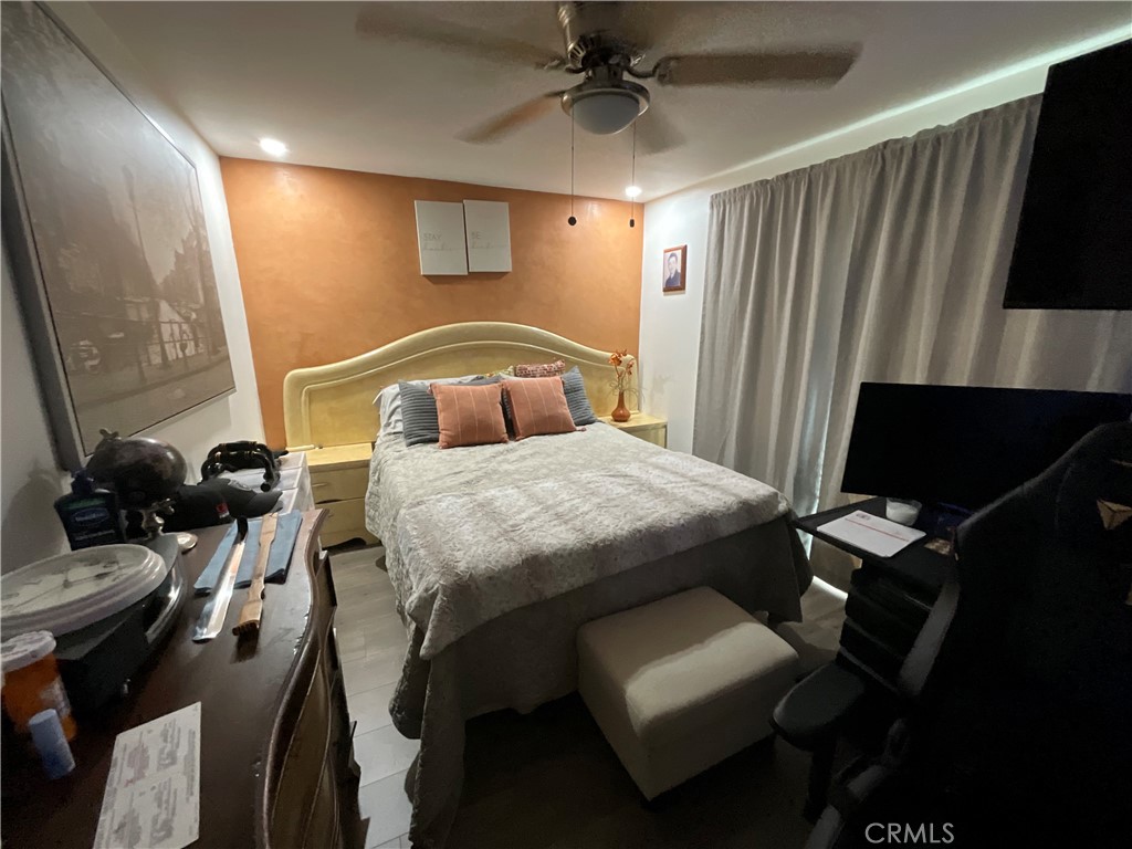 15621 Beach Boulevard, Unit 28 Huntington Beach, CA 92647 - Photo 8 of 27 a bedroom with a bed and a television