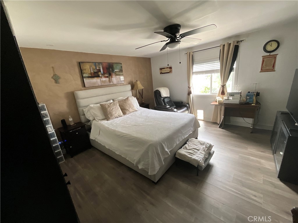 15621 Beach Boulevard, Unit 28 Huntington Beach, CA 92647 - Photo 9 of 27 a bedroom with a bed furniture and a window