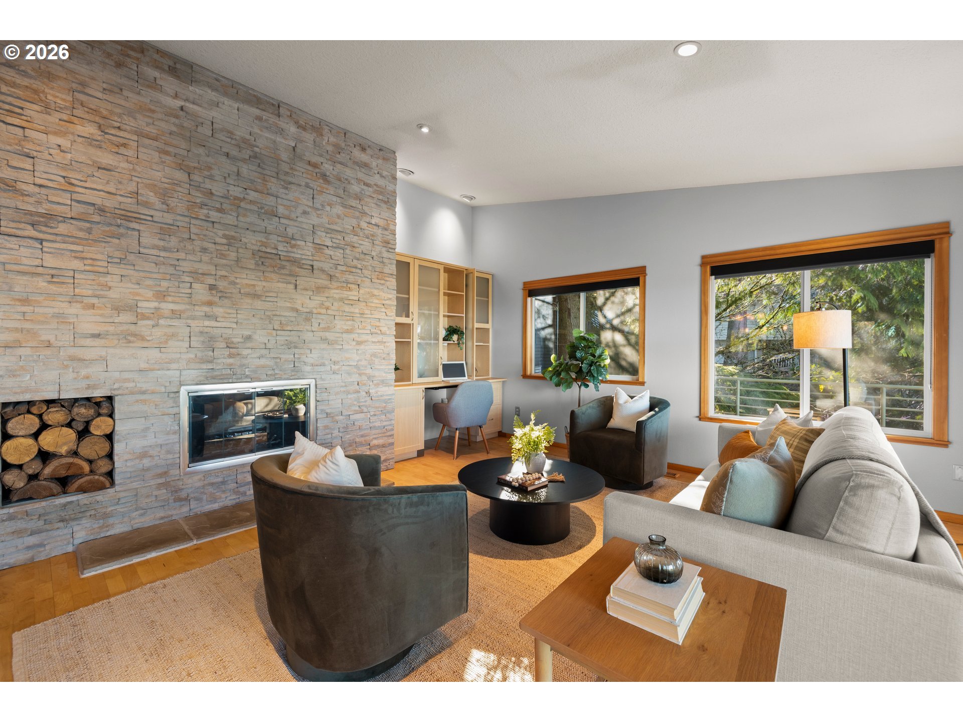 2831 Northeast Rocky Butte Road Portland, OR 97220 - Photo 16 of 33 a living room with furniture a fireplace and a large window