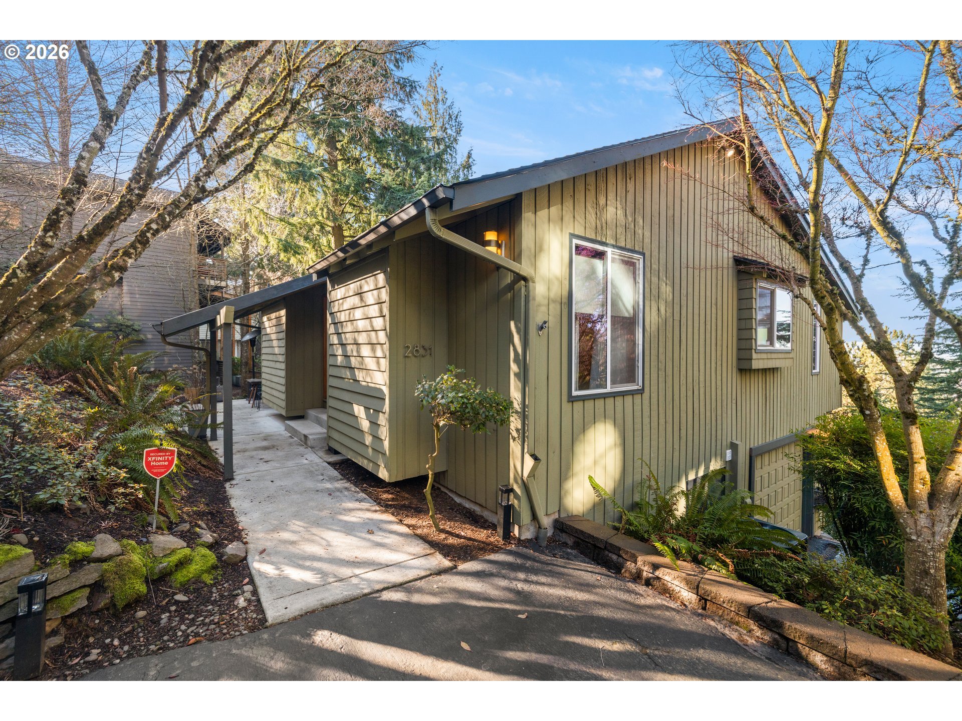 2831 Northeast Rocky Butte Road Portland, OR 97220 - Photo 2 of 33 a front view of a house with a yard