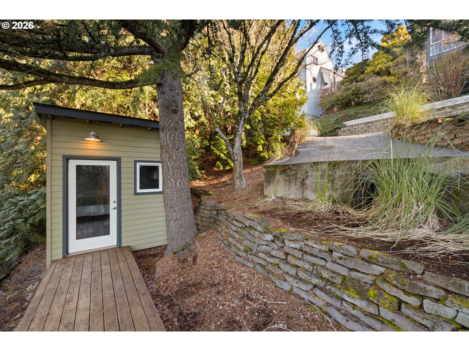 2831 Northeast Rocky Butte Road Portland, OR 97220 - Photo 29 of 33 a view of a wooden house with a yard