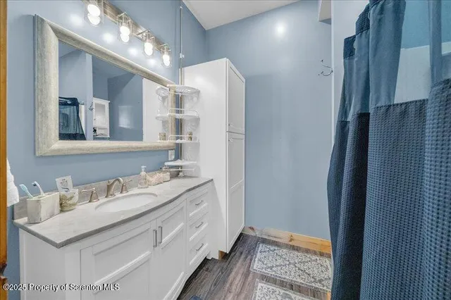 a bathroom with a sink double vanity and a mirror