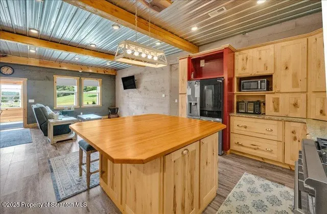 a kitchen with stainless steel appliances granite countertop a sink and cabinets