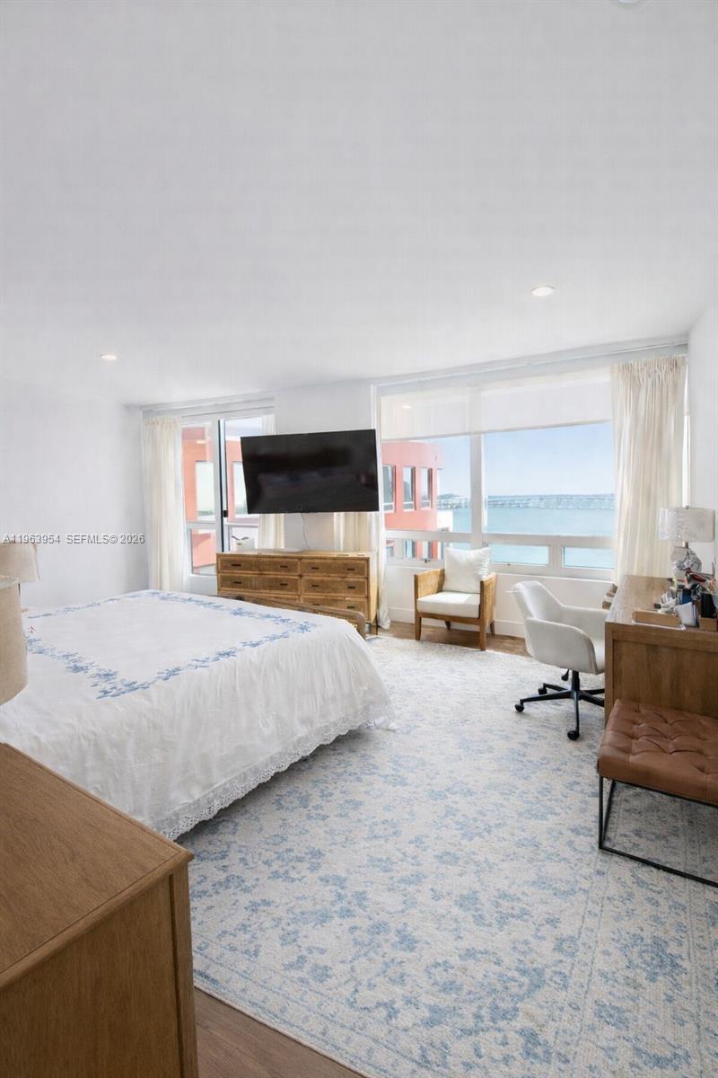 1541 Brickell Avenue, Unit B1504 Miami, FL 33129 - Photo 13 of 31 a spacious bedroom with a large bed and a large window