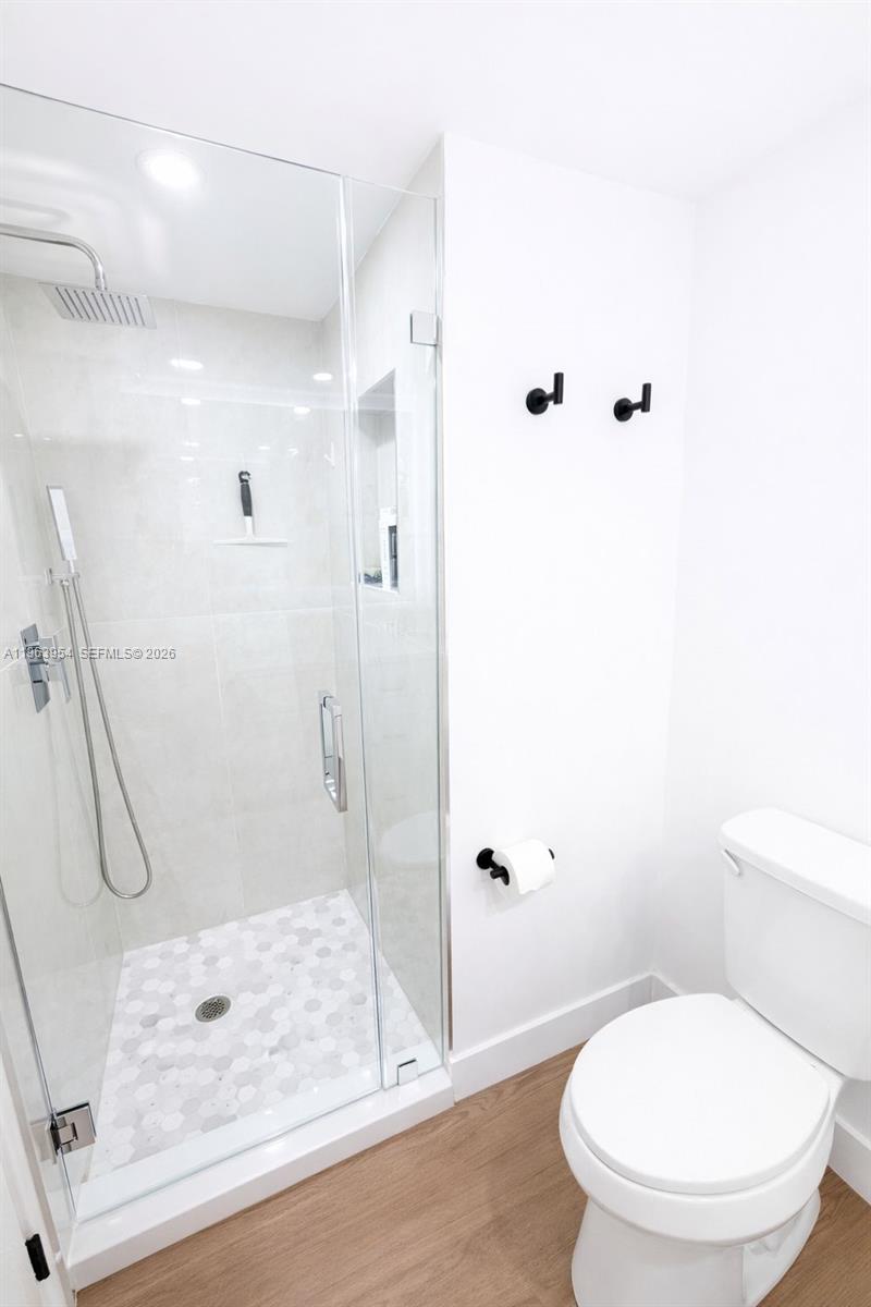 1541 Brickell Avenue, Unit B1504 Miami, FL 33129 - Photo 18 of 31 a bathroom with a toilet and shower