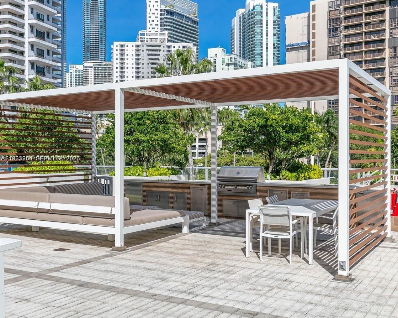 1541 Brickell Avenue, Unit B1504 Miami, FL 33129 - Photo 26 of 31 a view of a chairs and table in the balcony