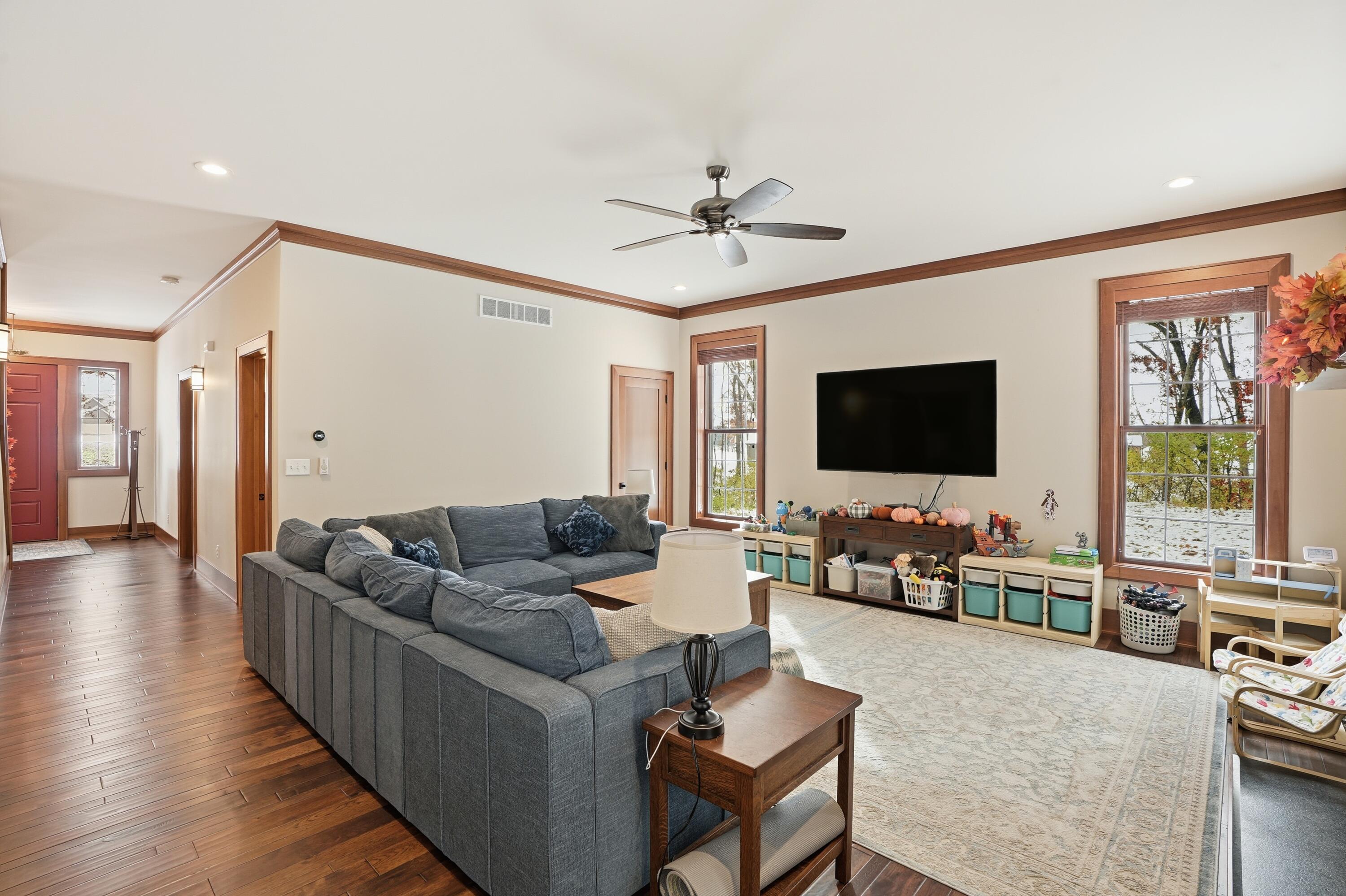 804 Shannon Drive Crown Point, IN 46307 - Photo 30 of 79 a living room with furniture flat screen tv and wooden floor