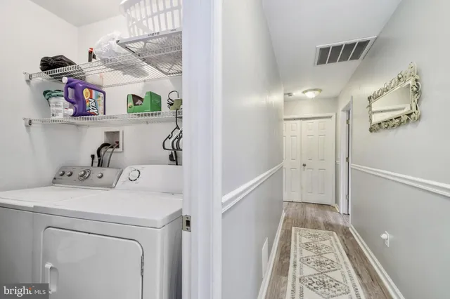 a view of storage and utility room with washer and dryer