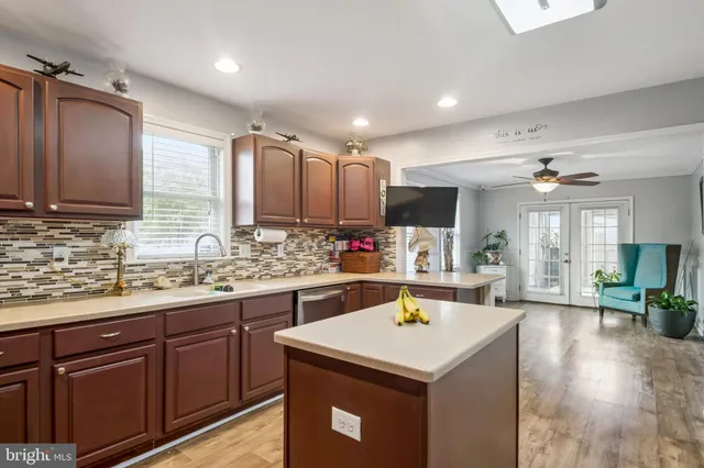 a kitchen with a sink a counter top space and appliances