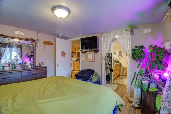 a bed room with a bed and a television