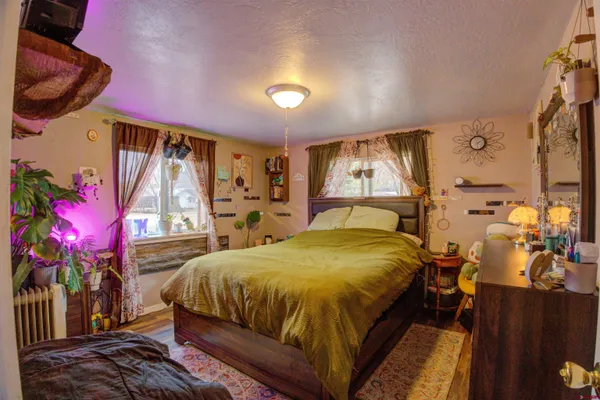 a bedroom with a bed and window