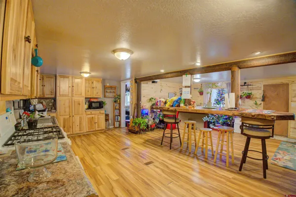 a very nice looking room with a large window and furniture