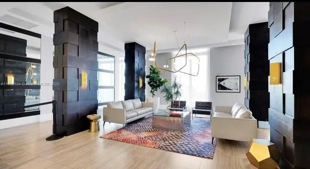 a view of a livingroom with furniture and window