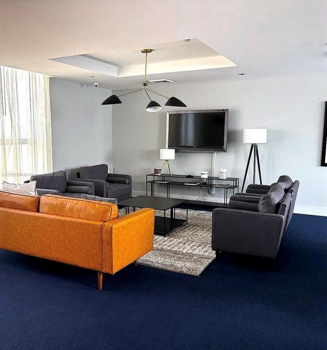 140 South Dixie Highway, Unit 921 Hollywood, FL 33020 - Photo 19 of 30 a living room with furniture and a flat screen tv