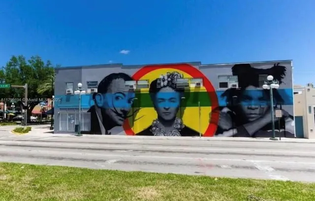 a view of a room with lots of wooden furniture
