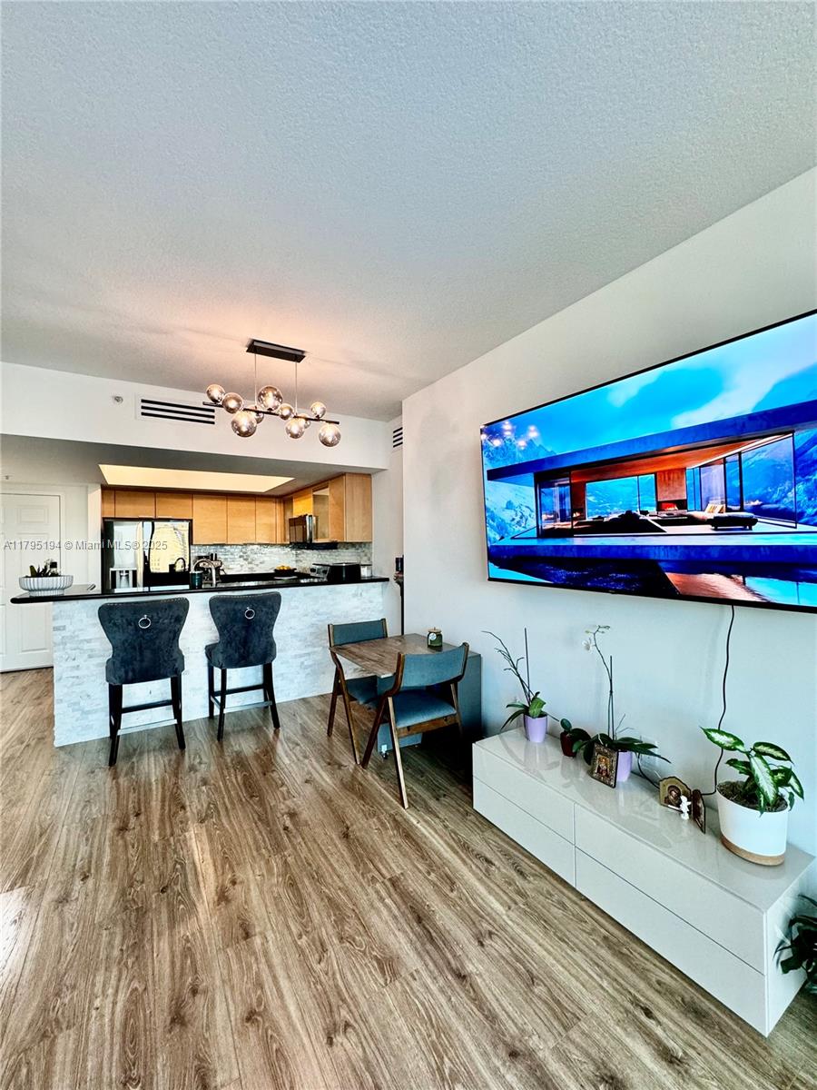 140 South Dixie Highway, Unit 921 Hollywood, FL 33020 - Photo 9 of 30 a reading room with furniture and wooden floor