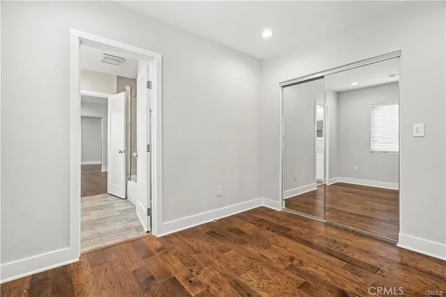 a bathroom with a sink and a mirror with bathtub