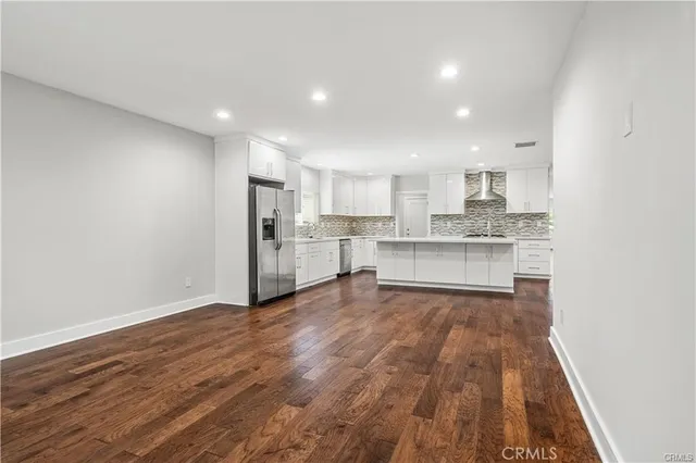 a view of kitchen with wooden floor