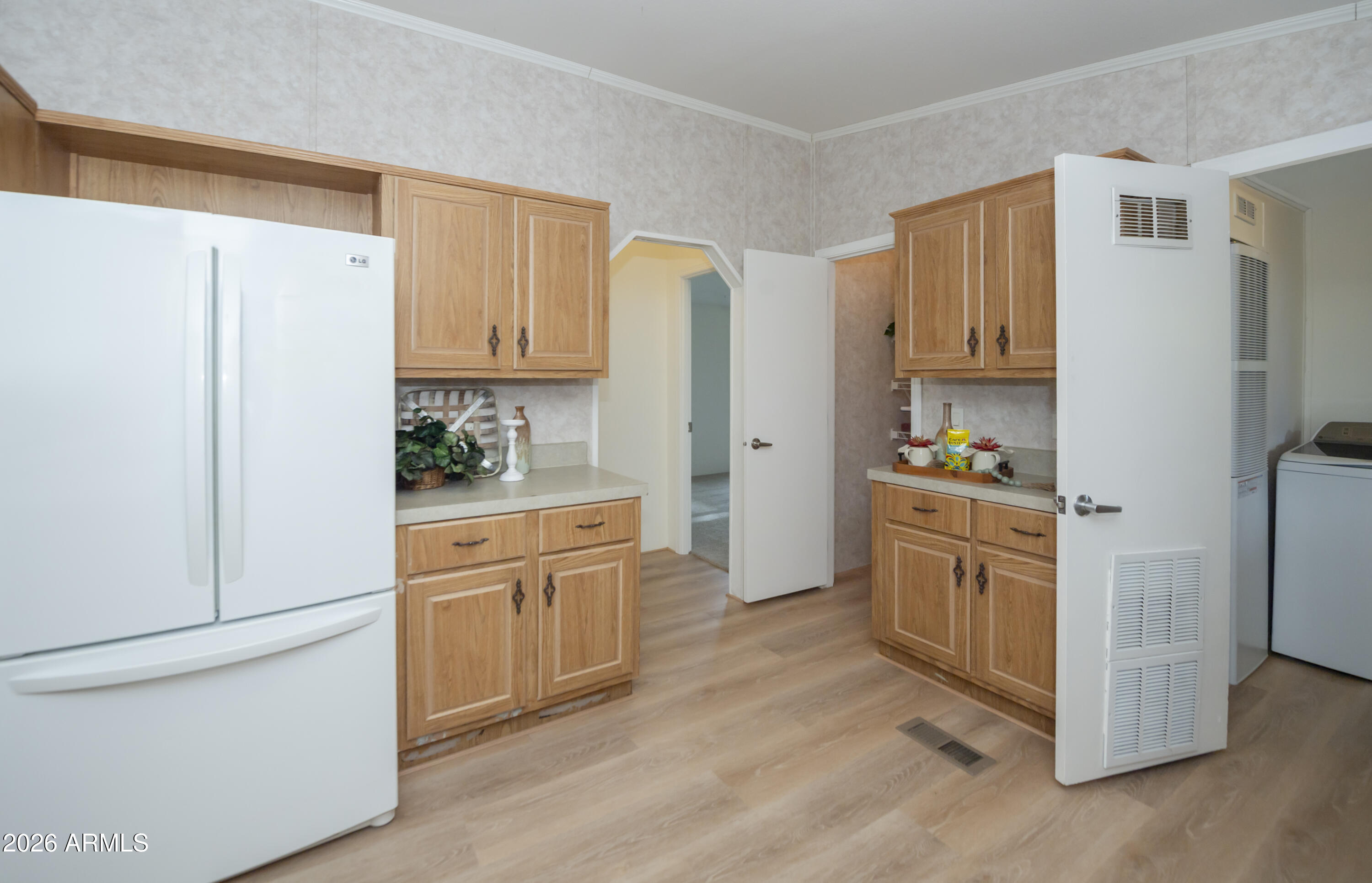11250 East State Rte 69, Unit 1125 Dewey, AZ 86327 - Photo 14 of 45 a kitchen with stainless steel appliances a refrigerator a stove a sink and cabinets