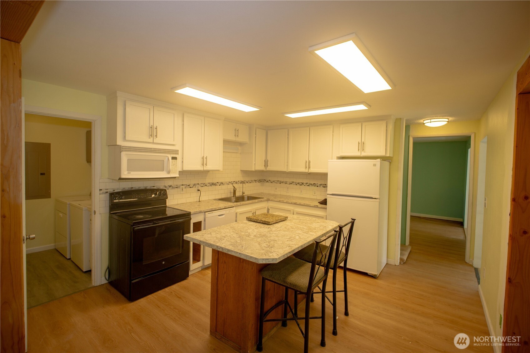 89 Slab Camp Road Sequim, WA 98382 - Photo 11 of 40 a kitchen that has a stove a sink and a refrigerator