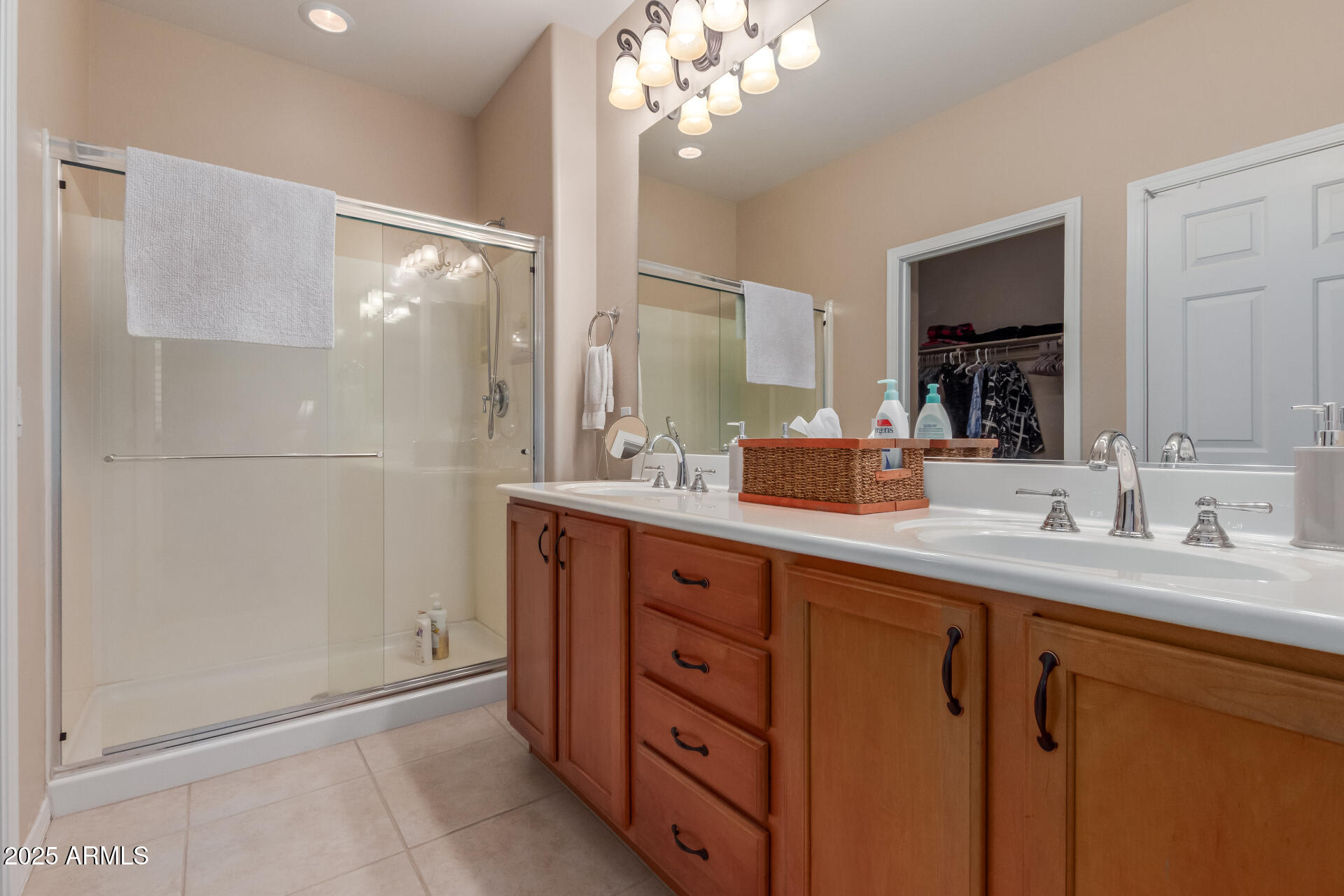 6573 West Mockingbird Way Florence, AZ 85132 - Photo 13 of 36 a spacious bathroom with a granite countertop sink a mirror and a shower