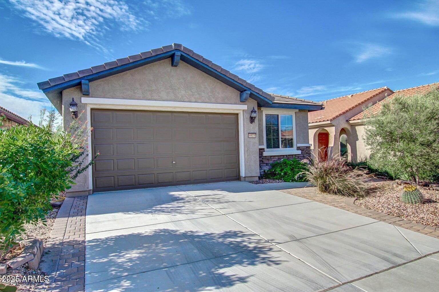 6573 West Mockingbird Way Florence, AZ 85132 - Photo 2 of 36 a front view of house with yard