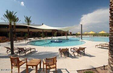 6573 West Mockingbird Way Florence, AZ 85132 - Photo 28 of 36 a view of a swimming pool with outdoor seating space