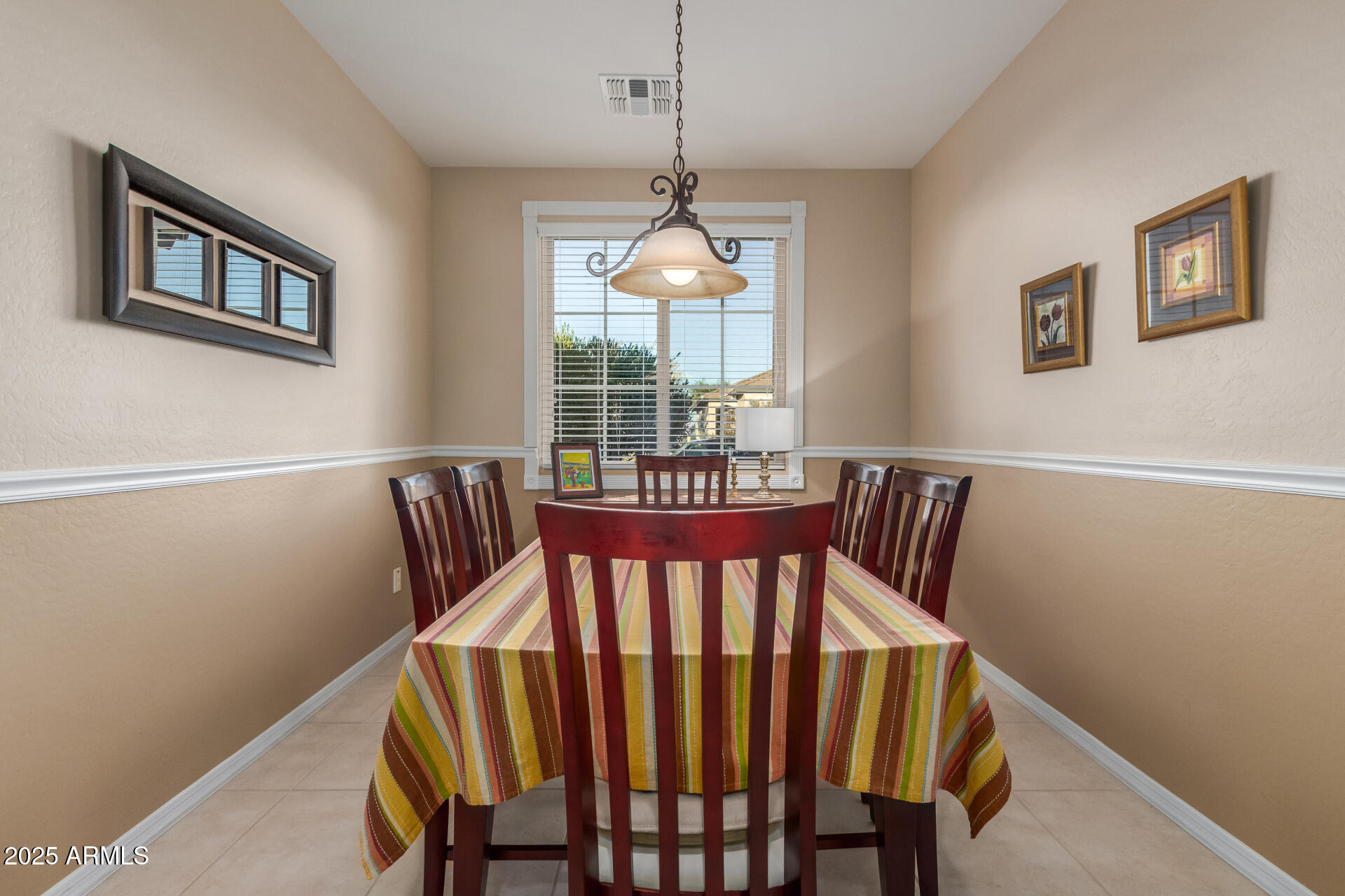 6573 West Mockingbird Way Florence, AZ 85132 - Photo 6 of 36 a view of a dining room with furniture and wooden floor