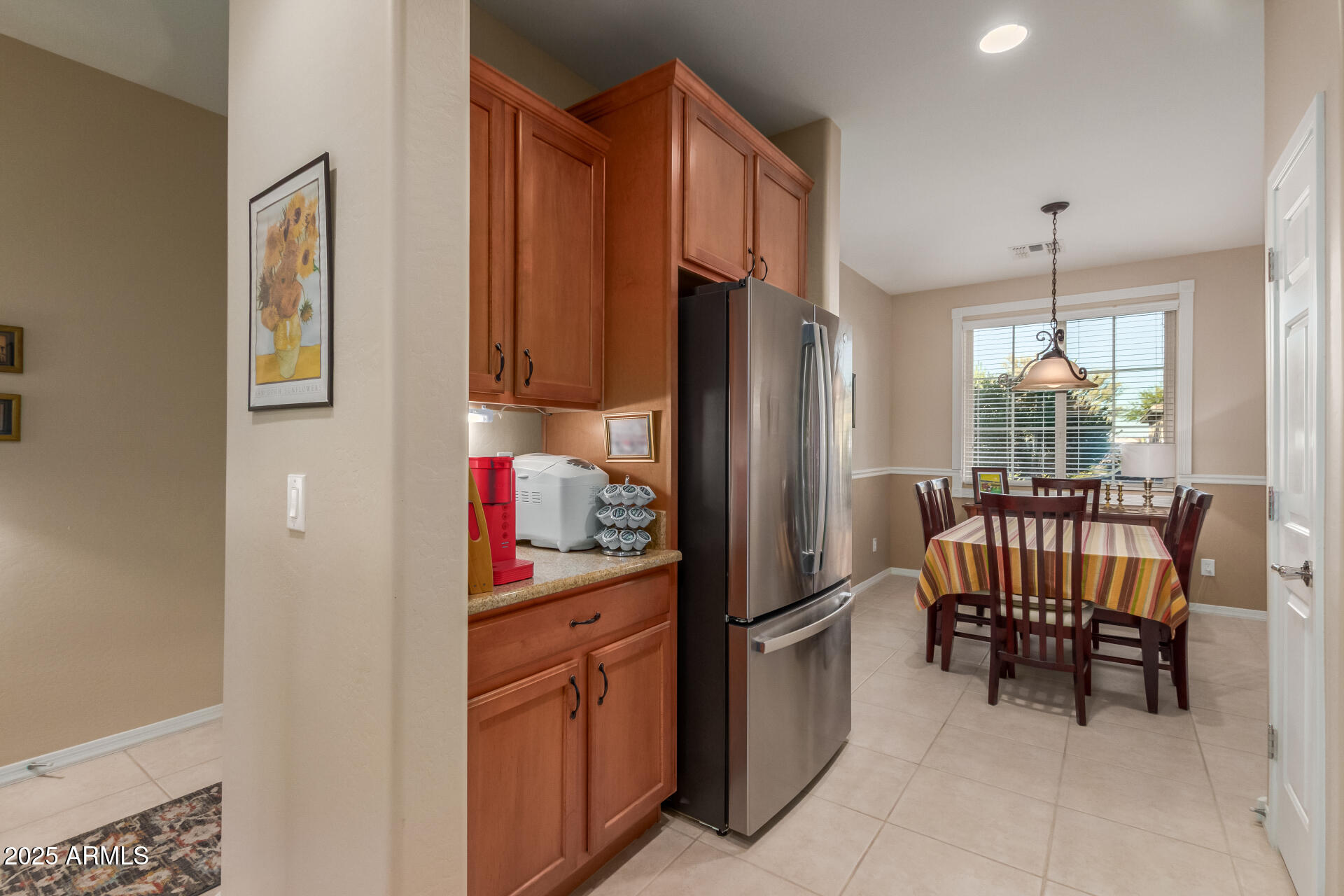 6573 West Mockingbird Way Florence, AZ 85132 - Photo 7 of 36 a kitchen with stainless steel appliances granite countertop a refrigerator and a sink