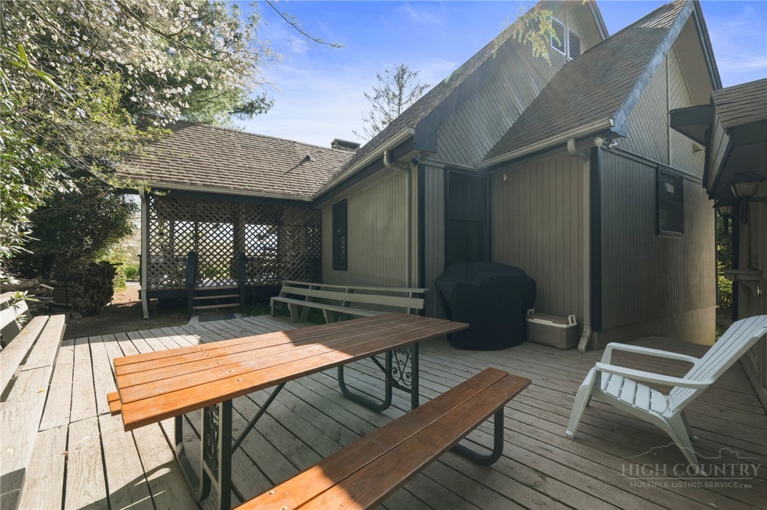83 Pine Ridge Loop Newland, NC 28657 - Photo 28 of 32 a view of a patio with a table and chairs
