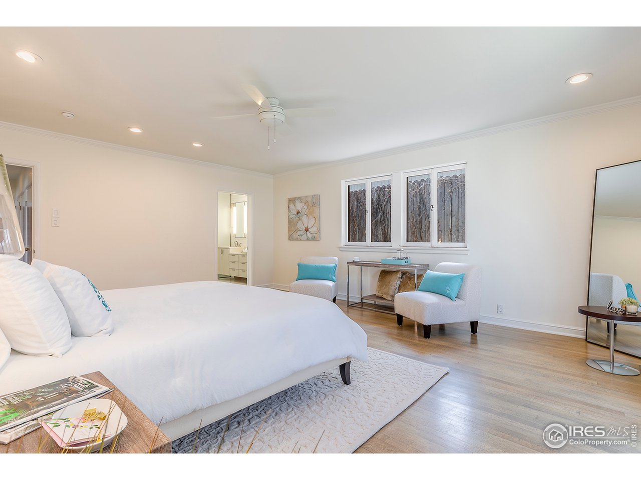 733 13th Street Boulder, CO 80302 - Photo 17 of 37 a bedroom with a bed and wooden floor