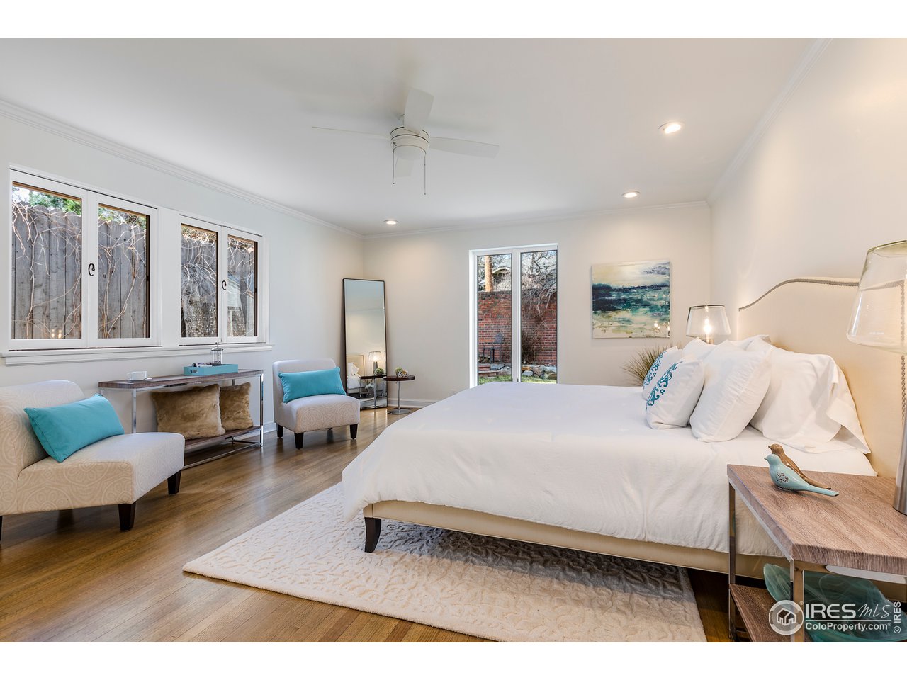 733 13th Street Boulder, CO 80302 - Photo 19 of 37 a bedroom with a bed a couch and dresser