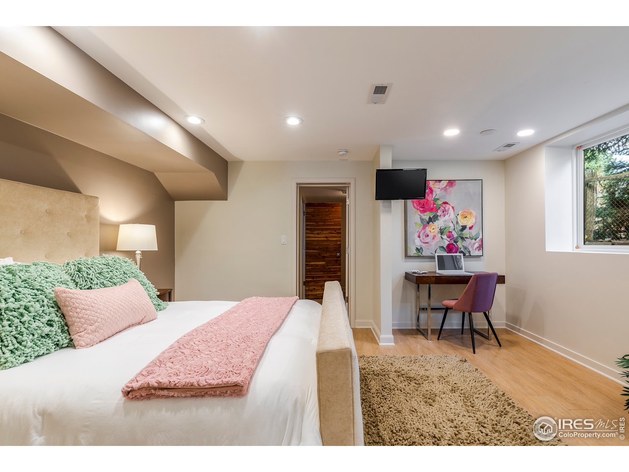 733 13th Street Boulder, CO 80302 - Photo 28 of 37 a living room with furniture and a flat screen tv