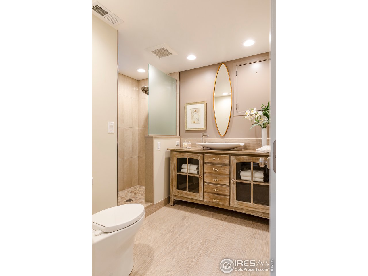 733 13th Street Boulder, CO 80302 - Photo 29 of 37 a bathroom with a granite countertop sink mirror vanity and toilet