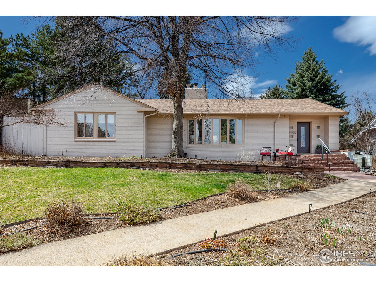 733 13th Street Boulder, CO 80302 - Photo 31 of 37 a view of house with a yard