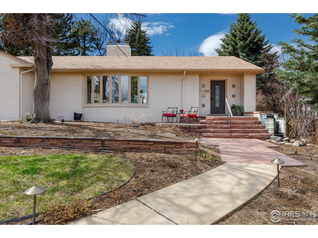 733 13th Street Boulder, CO 80302 - Photo 32 of 37 a view of a white house with tree s
