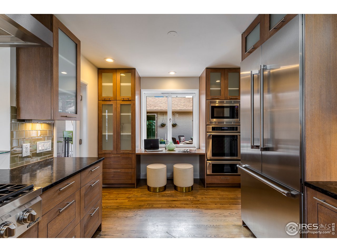 733 13th Street Boulder, CO 80302 - Photo 4 of 37 a kitchen with a counter top space a sink and stainless steel appliances