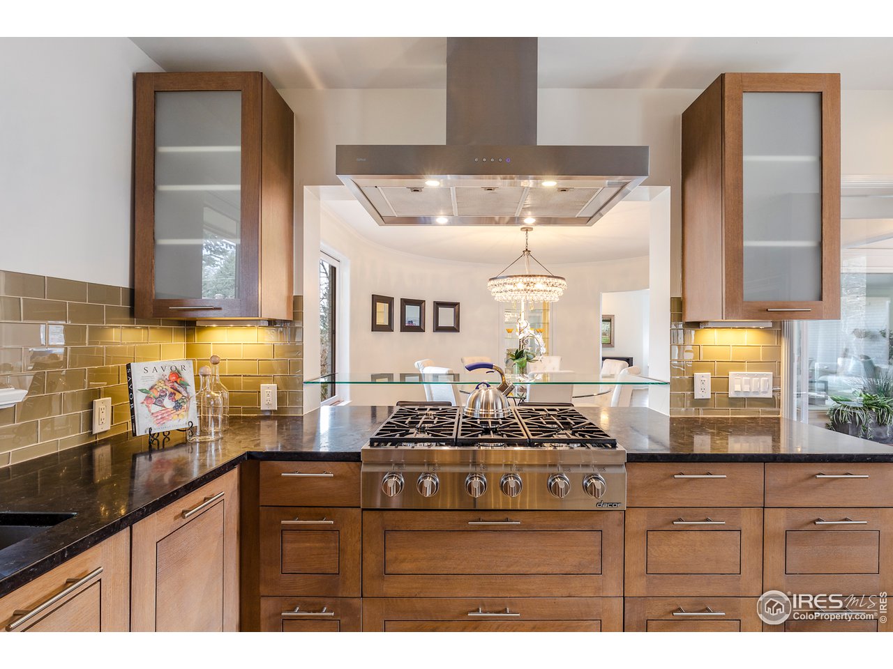 733 13th Street Boulder, CO 80302 - Photo 5 of 37 a kitchen with stainless steel appliances kitchen island granite countertop a sink and cabinets