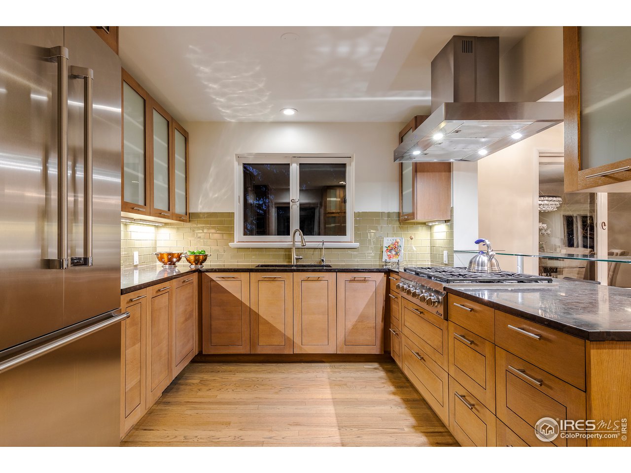 733 13th Street Boulder, CO 80302 - Photo 6 of 37 a kitchen with stainless steel appliances granite countertop a sink and cabinets