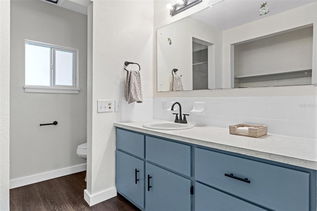 29129 Johnston Road, Unit 2626 Dade City, FL 33523 - Photo 11 of 31 a bathroom with a sink and a mirror