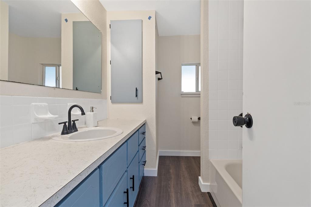 29129 Johnston Road, Unit 2626 Dade City, FL 33523 - Photo 15 of 31 a bathroom with a sink a toilet and shower