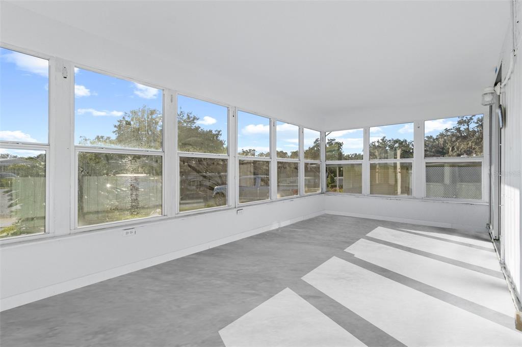 29129 Johnston Road, Unit 2626 Dade City, FL 33523 - Photo 17 of 31 a view of an empty room with a large window