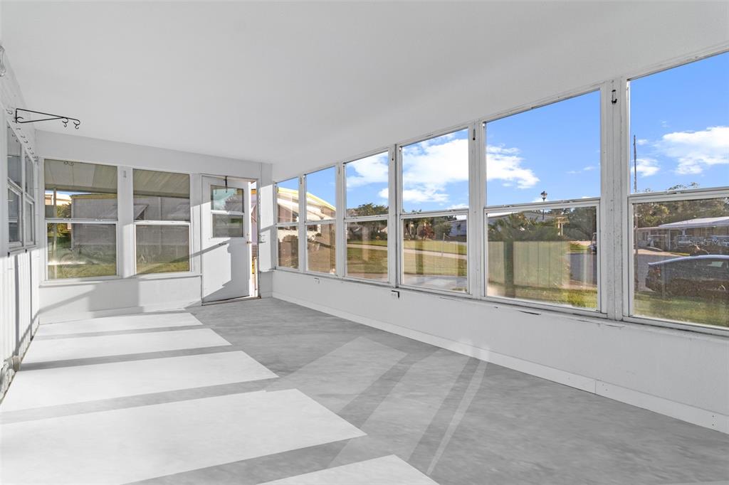 29129 Johnston Road, Unit 2626 Dade City, FL 33523 - Photo 18 of 31 a view of an empty room with a large window